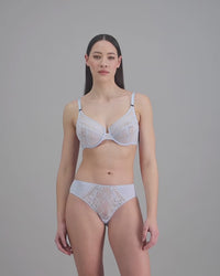 model-poses-in-light-blue-lingerie-set