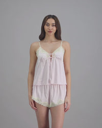 model-poses-in-pink-camisole-and-shorts