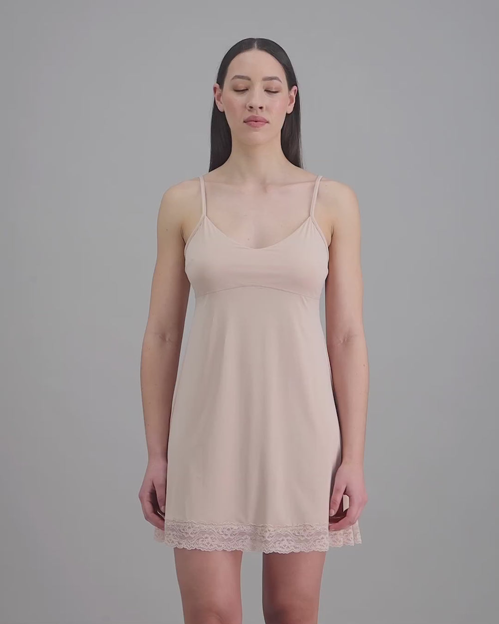 model-poses-in-latte-slip-dress