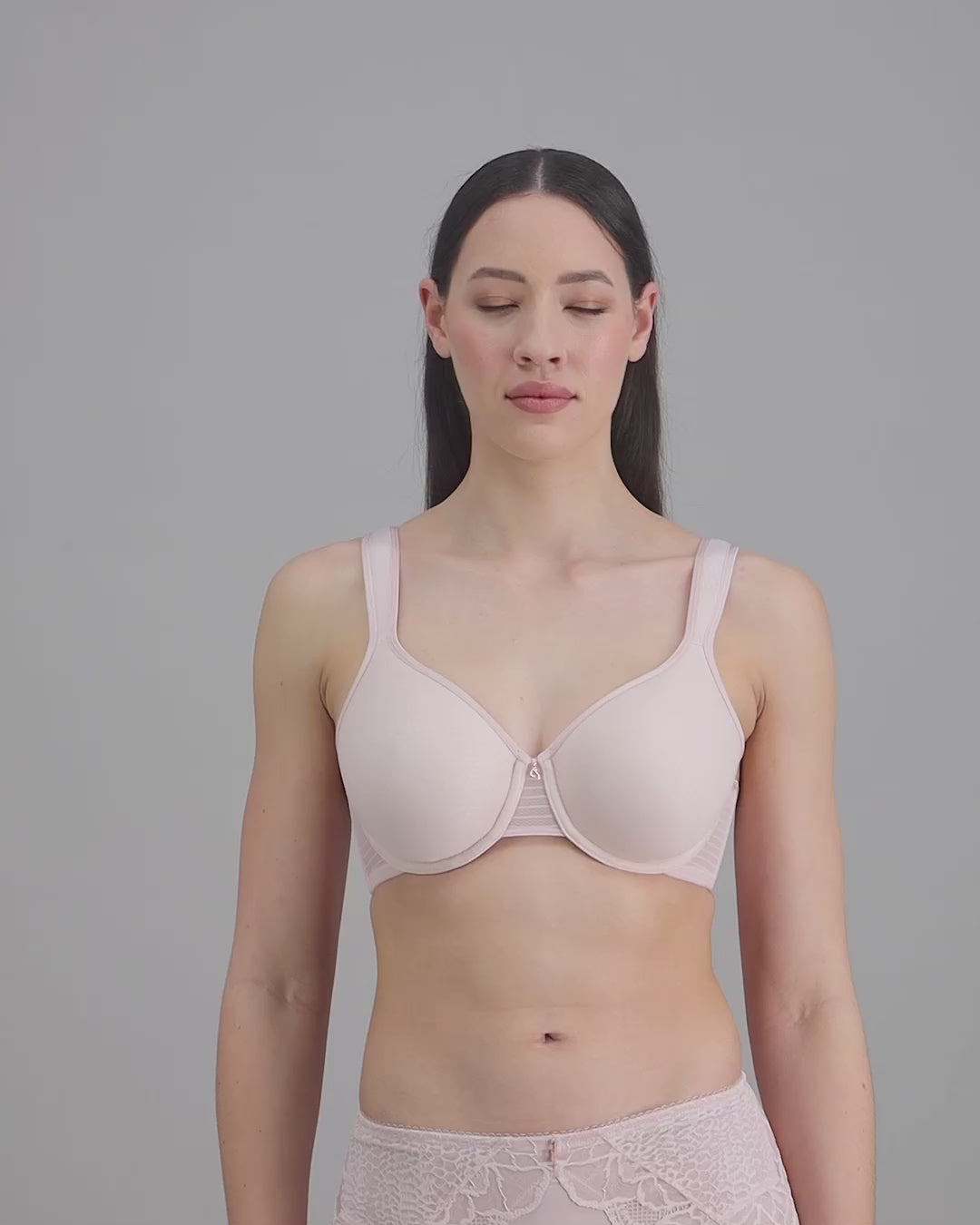 model-poses-in-pale-pink-lingerie-set
