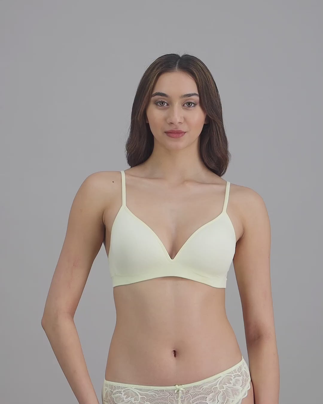 model-poses-in-light-yellow-lingerie-set